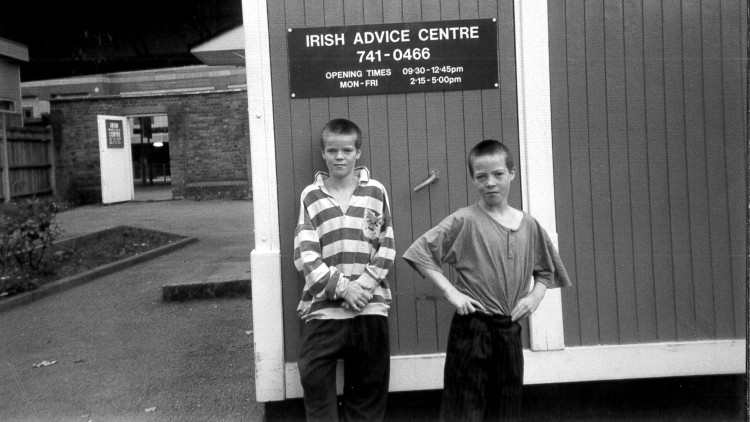 Two children outside the Irish Advice Centre at the Hammersmith and Fulham Irish Centre, year unknown.